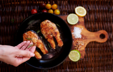 the cook Sprinkle steaks  fish seasoning