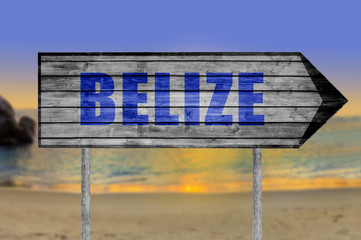 Belize wooden sign with beach background