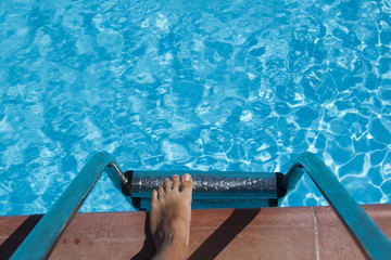 swimming pool with stairs and wather and a foot