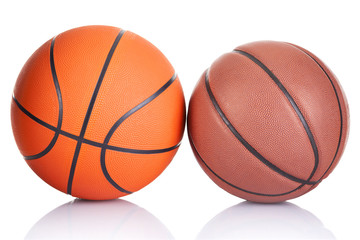 Fototapeta premium Two basketballs isolated on a white background