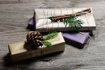 Stylish & rustic christmas gifts box presents on the old wooden table