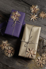 Stylish & modern rustic christmas gifts box presents on the old wooden table