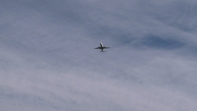 Plane descending from the clouds