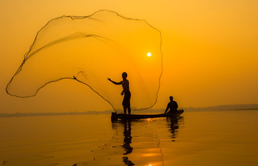 Fisherman action when fishing during sunset