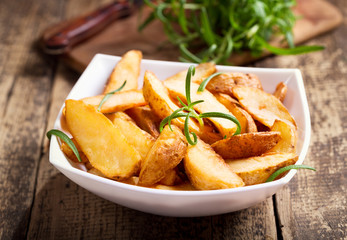 bowl of roasted potatoes with rosemary