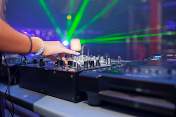 Fototapeta na wymiar DJ mixing music on console
