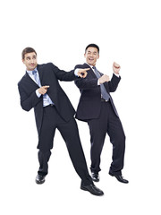 Businessmen dancing, isolated on white background