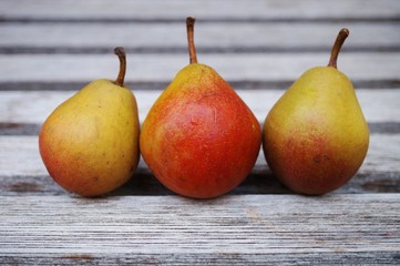 Three small pears in a row