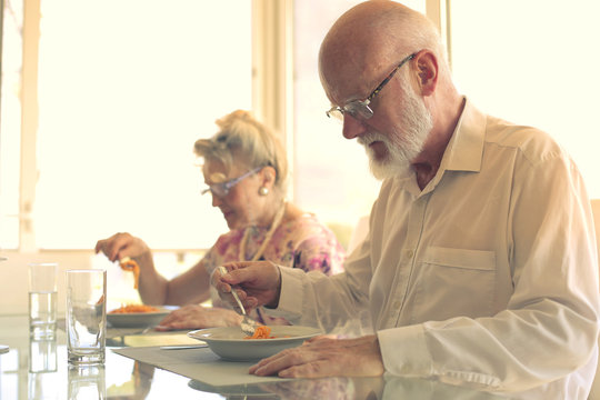 Elderly Couple Eating Together