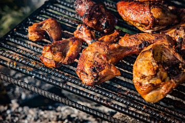 Chicken cooking on an open fire
