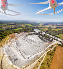 Aerial view to opencast mine. Use drones to inspect mining area. Modern technology theme.