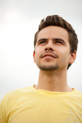 Fototapeta premium Portrait of a young man looking happily ahead