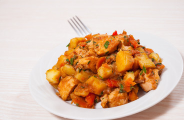 meat stew with potatoes, pepper, onion and carrot