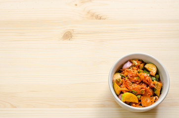 Fototapeta na wymiar Pickled mussels spicy salad on wooden table, Thai food.
