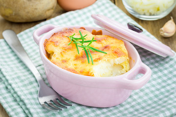 Potato gratin in ceramic mini cocotte