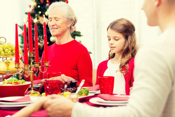 smiling family having holiday dinner at home