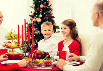 smiling family having holiday dinner at home