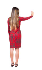 back view of young woman presses down on something