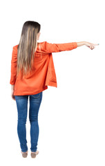 Back view of  pointing woman. beautiful girl.