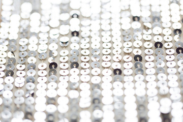 close up of silver sequined textile texture