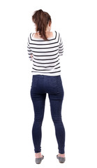 Obraz premium back view of standing young beautiful woman.