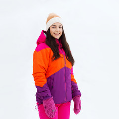 happy young woman in winter clothes outdoors