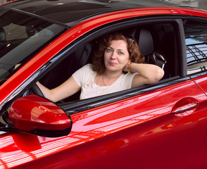 Women in the red car