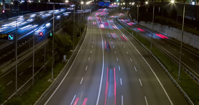 Night scene traffic and roads, top and rear view of entry and exit of Barcelona.Time Lapse - Long exposure - 4K.Smooth motion camera: TILT - PAN - ZOOM. (9)