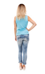 Fototapeta premium back view of standing young beautiful woman.
