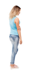 back view of standing young beautiful  woman.