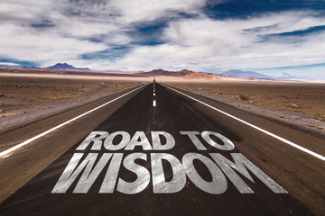 Road to Wisdom written on desert road