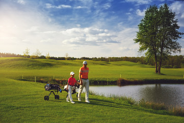 Father with son at golf field