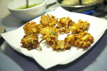 Fried vegetables draining on a paper towel