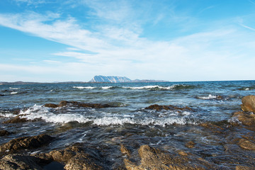 Sardinia coast in evening sunlight.