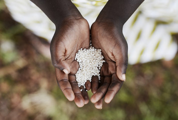 Starving Hunger Symbol Black African Boy Holding Rice Malnutrition (Congo). Stop hunger in the...