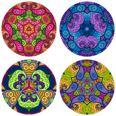 Set of four round colorful mandalas on a white background.