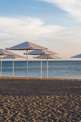 Fototapeta premium Umbrellas on the beach on the black sea