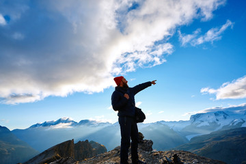hiker at the top of a pass