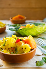 Cauliflower curry with pumpkin, paprika and arugula