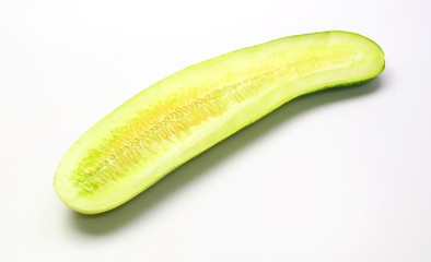 half cucumber on white background