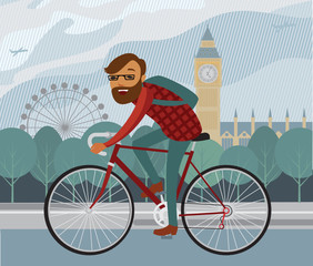 Young man hipster riding bike in London