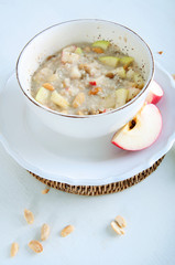 Oatmeal with fresh apples; peanuts and raisins