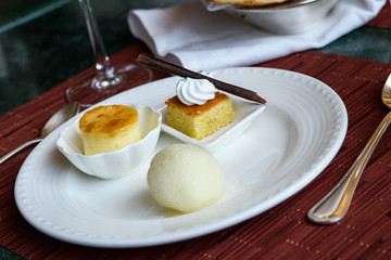 Indian desserts rossogolla, barfi and caramel custard