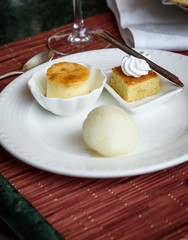 Indian desserts rossogolla, barfi and caramel custard
