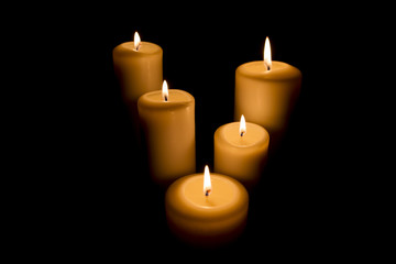 Fototapeta na wymiar five Candles on black background