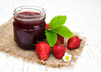 Strawberry jam and fresh strawberries