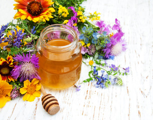 Obraz na płótnie Canvas Honey and wild flowers