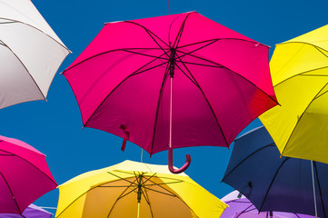 Street decorated with colored umbrellas. Arles, Provence. France