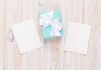 Gift box and blank photo frames