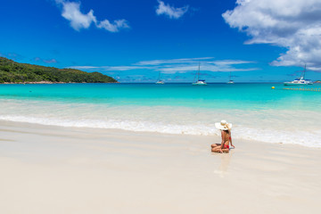 Girl at Anse Lazio - Paradise beach in Seychelles, tropical island Praslin
